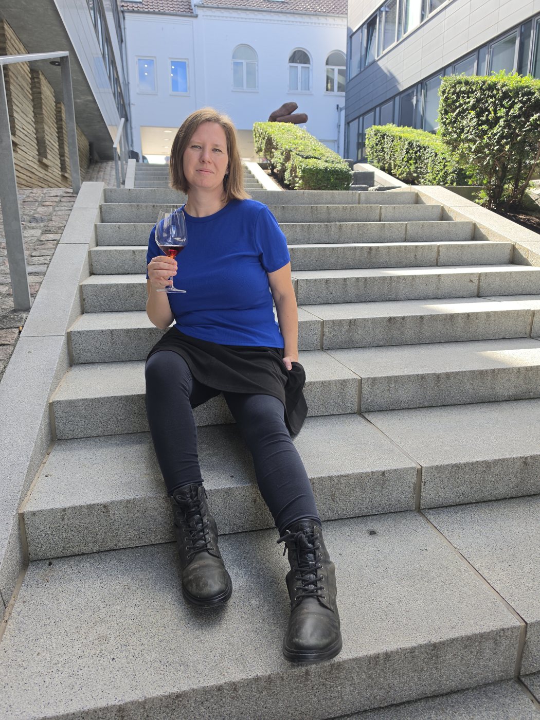 Louise Mosgaard with a glass of wine
