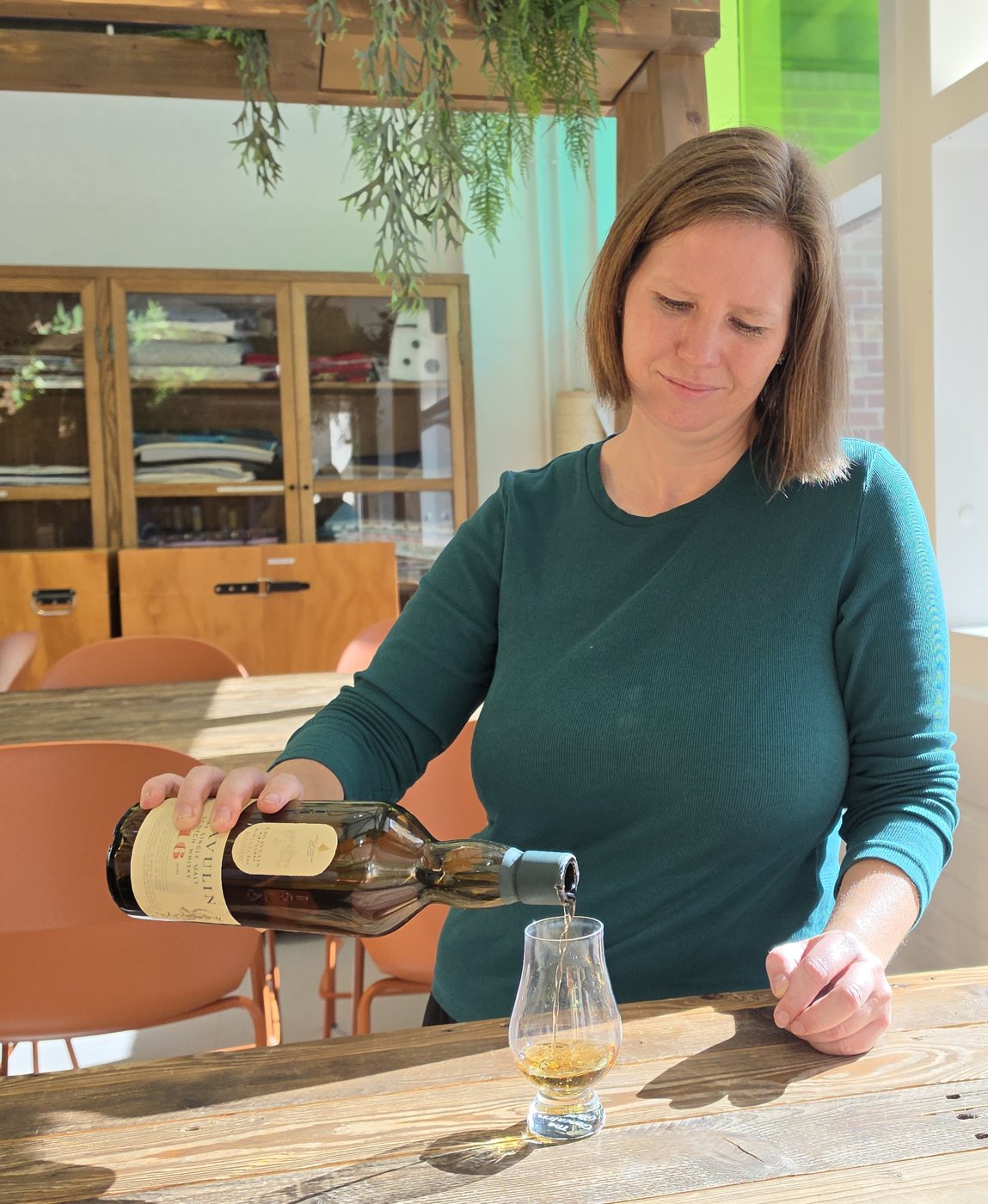 Louise pouring whisky