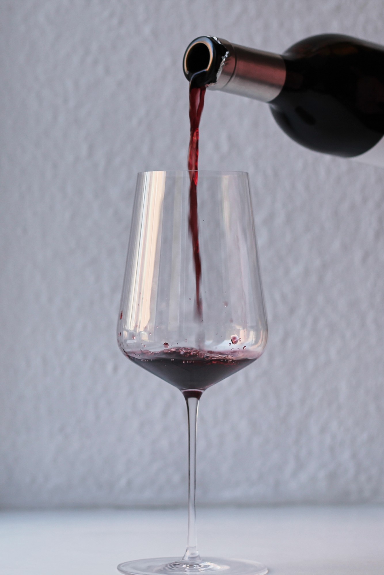Red wine being poured into a glass